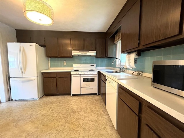 31 Dix Rd, Woburn, MA 01801 - kitchen featuring white appliances, under cabinet range hood, light countertops, and backsplash