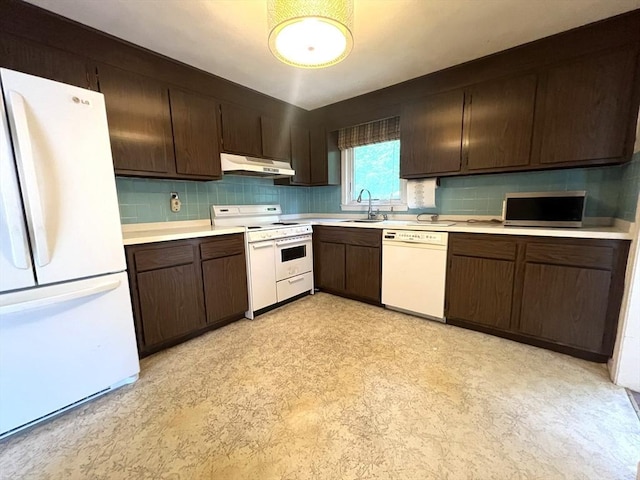 31 Dix Rd, Woburn, MA 01801 - kitchen with white appliances, under cabinet range hood, light flooring, light countertops, and tasteful backsplash