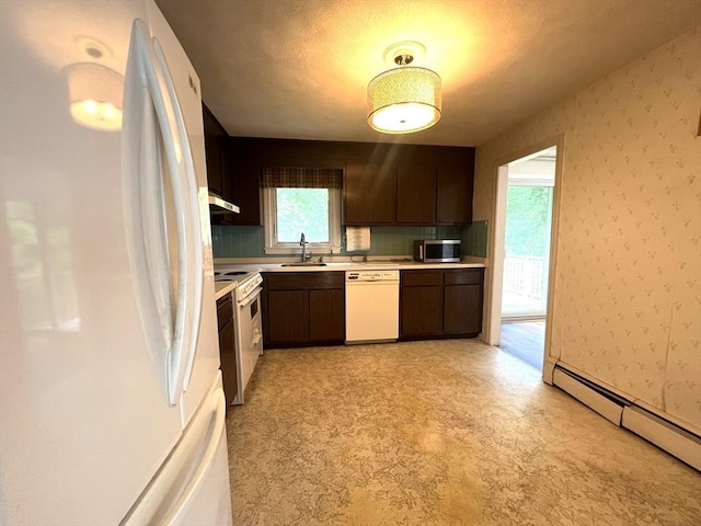 31 Dix Rd, Woburn, MA 01801 - kitchen with white appliances, a baseboard heating unit, light countertops, dark brown cabinets, and light floors