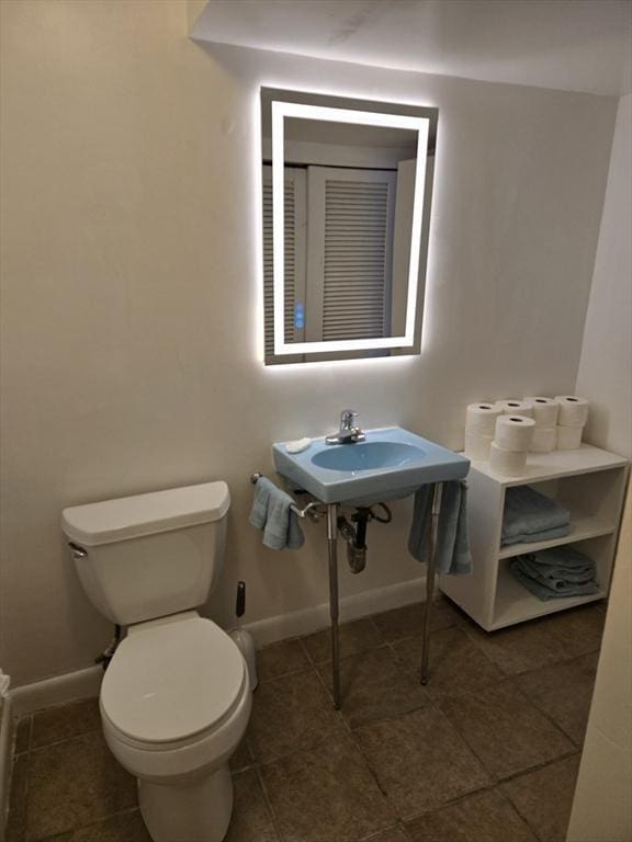 30 Leighton Rd, Boston, MA 02136 - bathroom with toilet, baseboards, and tile patterned floors