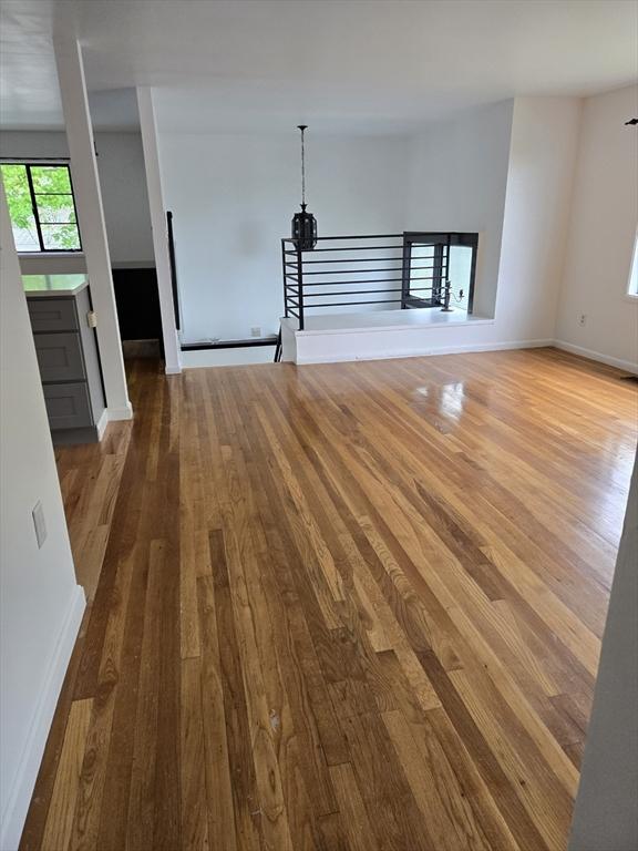 30 Leighton Rd, Boston, MA 02136 - unfurnished living room with wood finished floors and baseboards