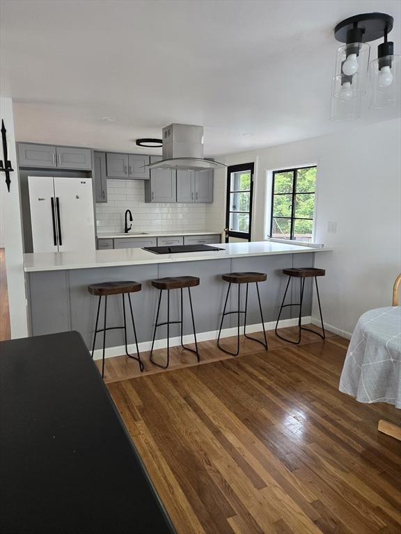 30 Leighton Rd, Boston, MA 02136 - kitchen featuring gray cabinetry, freestanding refrigerator, a sink, light countertops, and dark wood-type flooring