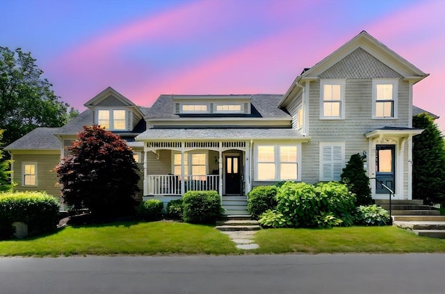 24 Pine Island Rd, Mattapoisett, MA 02739 - victorian home featuring a porch and a lawn