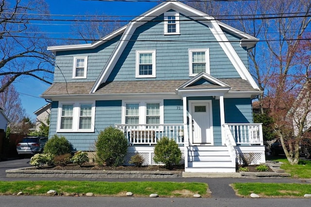 73 Harold St, Milton, MA 02186 - view of front of property featuring a gambrel roof, a porch, and a shingled roof