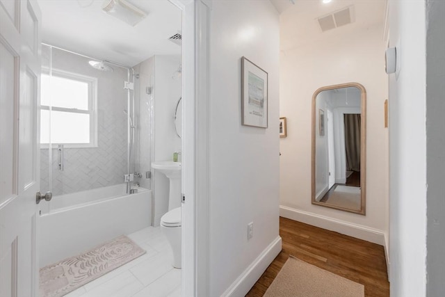 73 Harold St, Milton, MA 02186 - full bath with toilet,  shower combination, baseboards, and wood finished floors