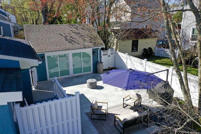 73 Harold St, Milton, MA 02186 - back of house featuring a patio area, a fenced backyard, and a shingled roof