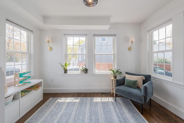 73 Harold St, Milton, MA 02186 - sitting room with healthy amount of natural light, dark wood-type flooring, and baseboards