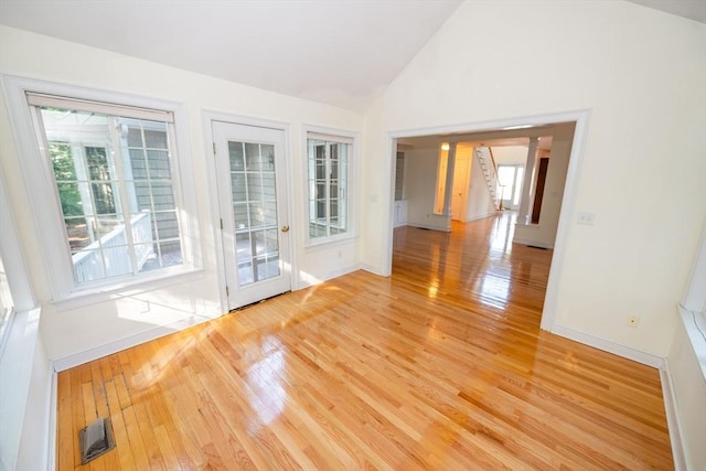 31 Mulligan Dr Unit 31, Weymouth, MA 02190 - spare room featuring light wood-type flooring and high vaulted ceiling