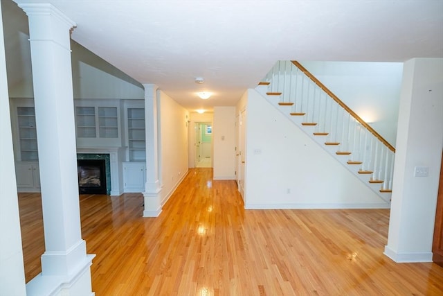 31 Mulligan Dr Unit 31, Weymouth, MA 02190 - hall with decorative columns, light wood-type flooring, and stairway