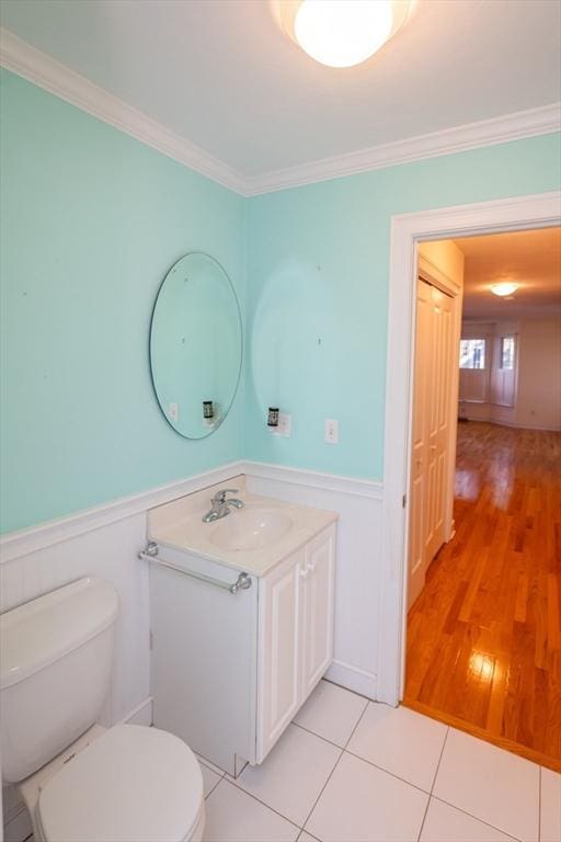 31 Mulligan Dr Unit 31, Weymouth, MA 02190 - bathroom featuring vanity, wainscoting, ornamental molding, and tile patterned flooring