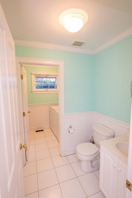 31 Mulligan Dr Unit 31, Weymouth, MA 02190 - bathroom with a wainscoted wall, vanity, ornamental molding, tile patterned flooring, and washer / dryer