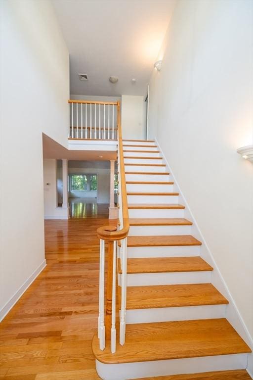 31 Mulligan Dr Unit 31, Weymouth, MA 02190 - stairs featuring wood finished floors and a high ceiling