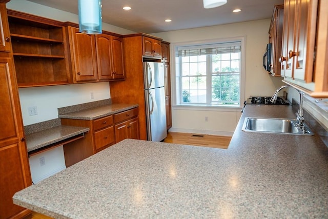 31 Mulligan Dr Unit 31, Weymouth, MA 02190 - kitchen with freestanding refrigerator, brown cabinetry, recessed lighting, light wood finished floors, and open shelves