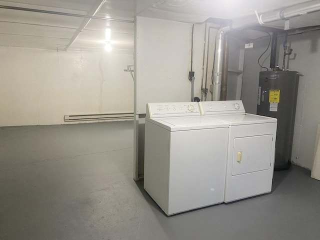 laundry area featuring laundry area, washer and clothes dryer, and electric water heater