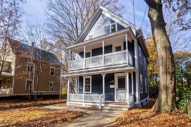 view of front of property with a balcony and a porch