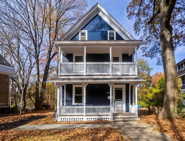 view of front of home with covered porch and a balcony