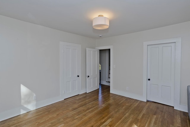 interior space with dark hardwood / wood-style flooring