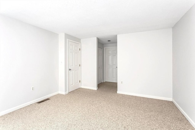 spare room with carpet floors