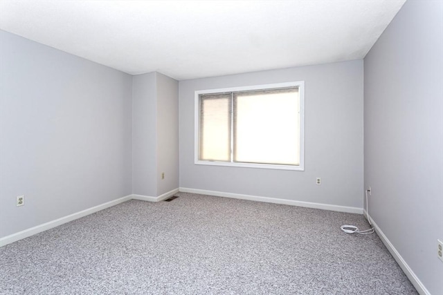 spare room with carpet