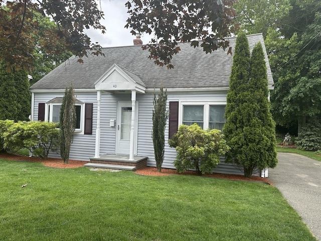 40 Elmwood Cir, Peabody, MA 01960 - cape cod house with a shingled roof, a front lawn, and a chimney
