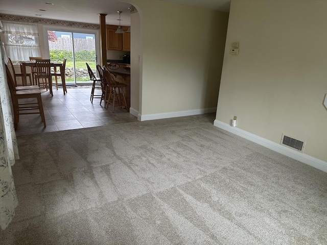 40 Elmwood Cir, Peabody, MA 01960 - living room with light colored carpet, baseboards, and arched walkways
