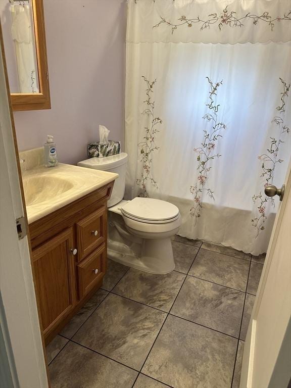 40 Elmwood Cir, Peabody, MA 01960 - bathroom with vanity, toilet, tile patterned floors, and shower / bathtub combination with curtain