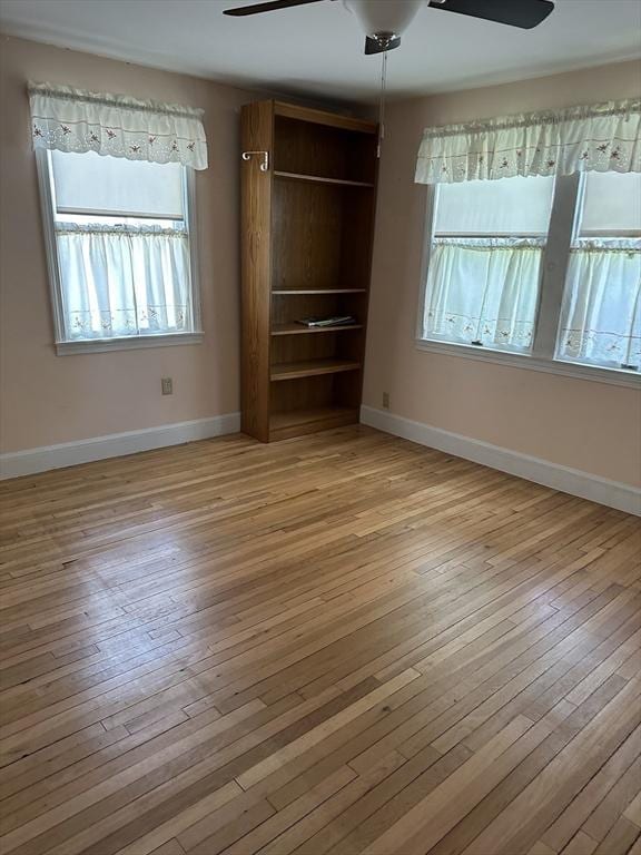 40 Elmwood Cir, Peabody, MA 01960 - unfurnished bedroom with light wood-style floors, baseboards, and ceiling fan