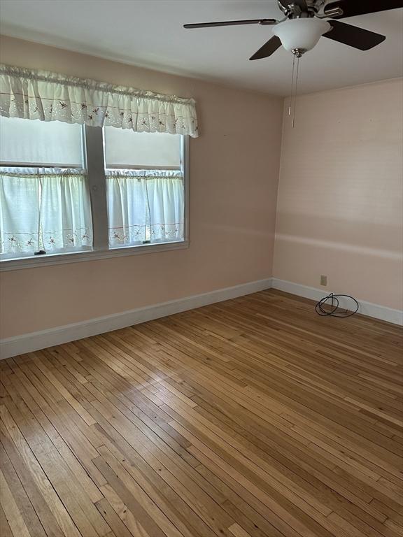40 Elmwood Cir, Peabody, MA 01960 - empty room featuring hardwood / wood-style flooring, ceiling fan, and baseboards