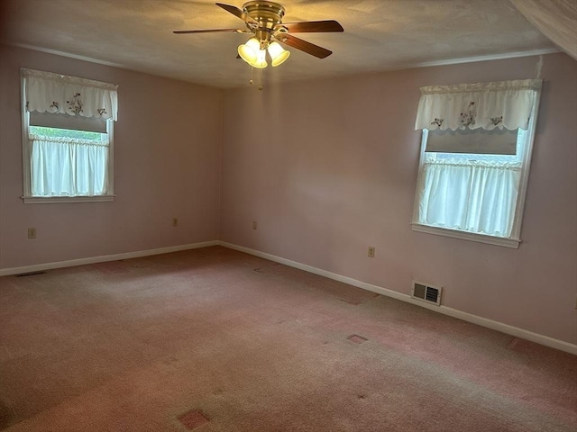 40 Elmwood Cir, Peabody, MA 01960 - empty room featuring a ceiling fan, light carpet, and baseboards