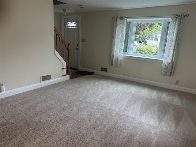 40 Elmwood Cir, Peabody, MA 01960 - carpeted foyer entrance featuring healthy amount of natural light, stairs, and baseboards