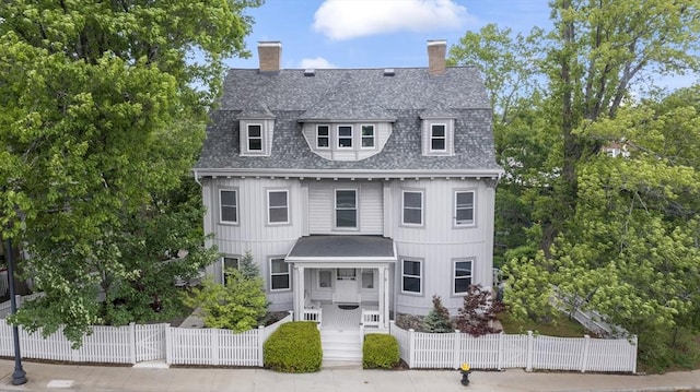 388 Arborway, Boston, MA 02130 - victorian home featuring a fenced front yard, a chimney, a shingled roof, board and batten siding, and a gate