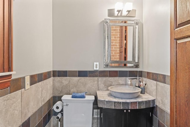 388 Arborway, Boston, MA 02130 - bathroom with toilet, tile walls, a wainscoted wall, and vanity