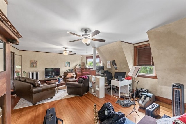 388 Arborway, Boston, MA 02130 - living area with hardwood / wood-style floors, a desk, radiator heating unit, and a ceiling fan