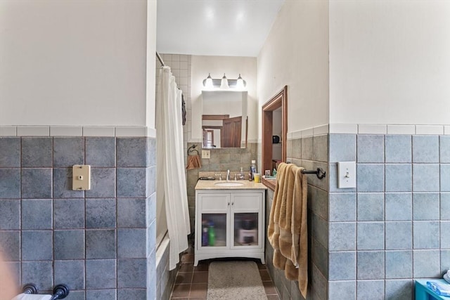 388 Arborway, Boston, MA 02130 - full bath with tile walls, tile patterned flooring, a shower with shower curtain, wainscoting, and vanity