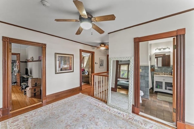 388 Arborway, Boston, MA 02130 - hall with an upstairs landing, wood finished floors, crown molding, baseboards, and a sink
