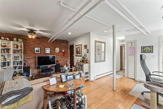 388 Arborway, Boston, MA 02130 - living area with a baseboard radiator, a ceiling fan, light wood-style flooring, brick wall, and baseboards