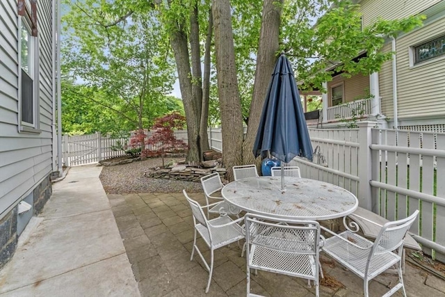 388 Arborway, Boston, MA 02130 - fenced backyard featuring a patio and outdoor dining area