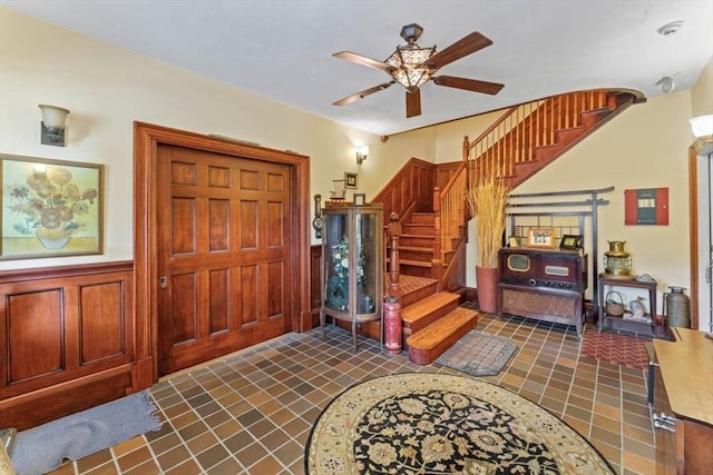 388 Arborway, Boston, MA 02130 - foyer entrance with stairway, ceiling fan, and wainscoting