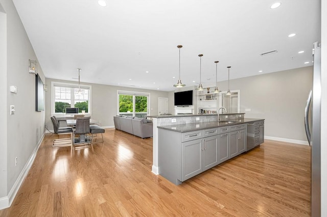 2 Inwood Dr Unit 3003, Woburn, MA 01801 - kitchen featuring a sink, open floor plan, light wood finished floors, appliances with stainless steel finishes, and recessed lighting