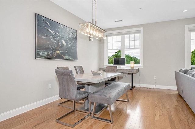 2 Inwood Dr Unit 3003, Woburn, MA 01801 - dining space with wood finished floors, baseboards, and healthy amount of natural light