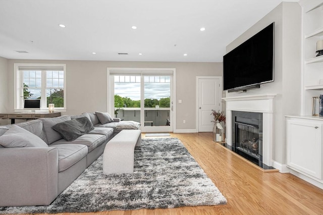 2 Inwood Dr Unit 3003, Woburn, MA 01801 - living room featuring a glass covered fireplace, wood finished floors, and recessed lighting