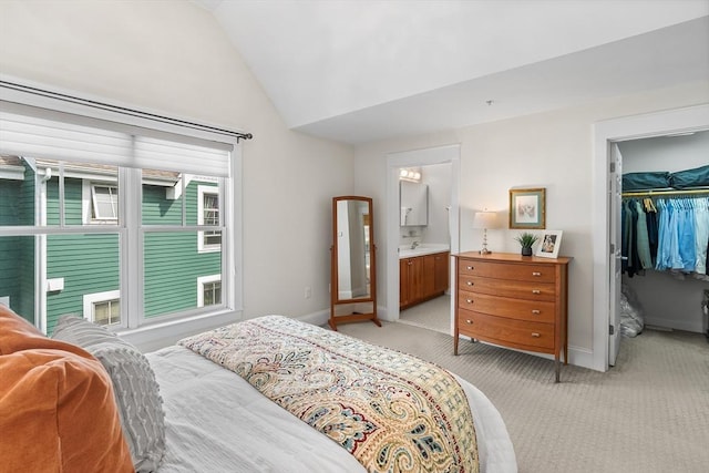 26-B Lake St Unit 26B, Somerville, MA 02143 - bedroom featuring vaulted ceiling, light colored carpet, a spacious closet, baseboards, and a closet