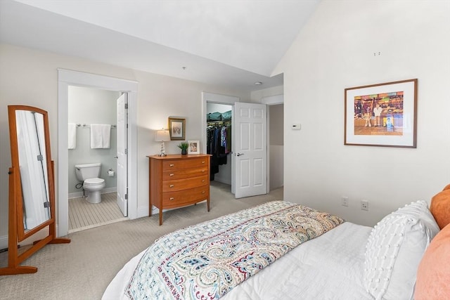 26-B Lake St Unit 26B, Somerville, MA 02143 - bedroom with light colored carpet, lofted ceiling, a spacious closet, a closet, and baseboards