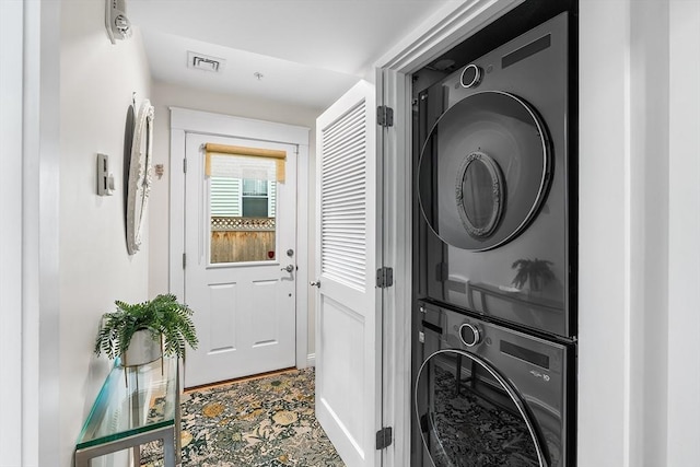 26-B Lake St Unit 26B, Somerville, MA 02143 - laundry room with estacked washer and dryer and baseboards