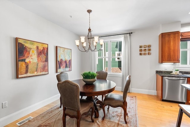 26-B Lake St Unit 26B, Somerville, MA 02143 - dining area with light wood-style floors, a chandelier, and baseboards