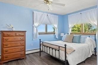 16 Simmons Rd, Nahant, MA 01908 - bedroom with a baseboard heating unit, dark wood finished floors, and ceiling fan