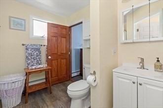 16 Simmons Rd, Nahant, MA 01908 - bathroom with vanity, toilet, and wood finished floors