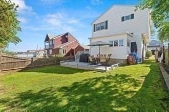 16 Simmons Rd, Nahant, MA 01908 - back of property featuring a yard and a fenced backyard