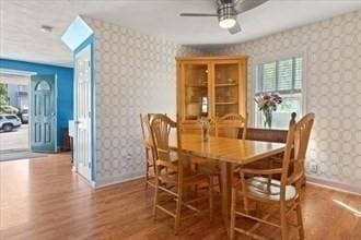 16 Simmons Rd, Nahant, MA 01908 - dining space with plenty of natural light, baseboards, wallpapered walls, and wood finished floors