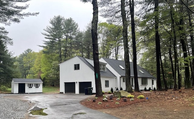 47 Woodcock Ln, Marlborough, MA 01752 - view of front facade featuring asphalt driveway and an attached garage